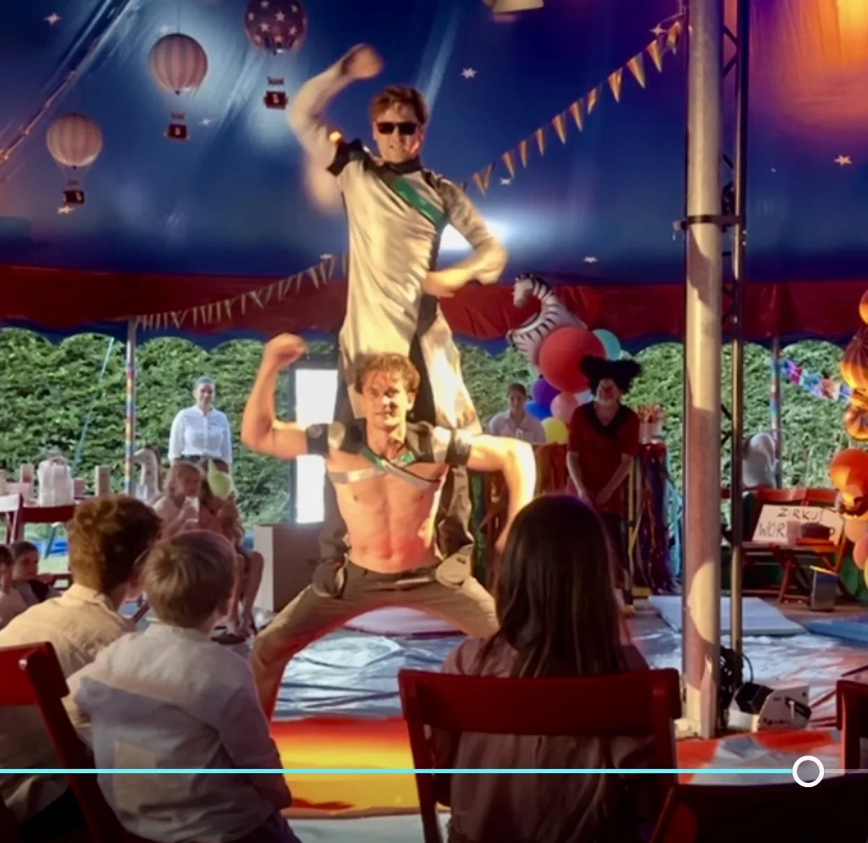 Jim & John hero pose in the children's circus tent